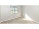 Bedroom featuring natural light from the window, neutral carpet, and gray walls at 8506 Friendship Ln, Indianapolis, IN 46217