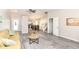 Inviting living room featuring gray flooring, a soft gold sofa and an open-concept design at 8506 Friendship Ln, Indianapolis, IN 46217