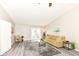 Bright living room showcasing wood floors, a comfortable sofa, and access to the backyard at 8506 Friendship Ln, Indianapolis, IN 46217
