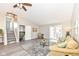 Spacious living room with neutral paint, staircase, and double doors to the back at 8506 Friendship Ln, Indianapolis, IN 46217