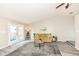 Bright living room featuring gray flooring, high ceilings and French doors at 8506 Friendship Ln, Indianapolis, IN 46217