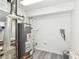 A utility room with a water heater and space for storage at 8506 Friendship Ln, Indianapolis, IN 46217