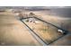 Aerial view of the property showcasing the home, outbuildings, and surrounding land at 8543 W County Road 600 S, Coatesville, IN 46121