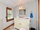 Bathroom featuring a large sink, vanity with storage, and a window for natural light at 8543 W County Road 600 S, Coatesville, IN 46121