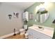 Fresh bathroom features a clean white vanity, toilet and a shower-tub combo at 8543 W County Road 600 S, Coatesville, IN 46121