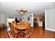 Traditional dining room features wood floors and a large table for Gathering gatherings at 8543 W County Road 600 S, Coatesville, IN 46121