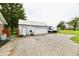 Spacious detached garage with ample parking space and an attached storage area for equipment at 8543 W County Road 600 S, Coatesville, IN 46121