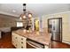 Well-appointed kitchen with a large island, stainless steel appliances, and a seamless flow to the living area at 8543 W County Road 600 S, Coatesville, IN 46121