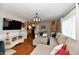 Open living area showcases modern decor, a large TV, and seamless transition to the kitchen at 8543 W County Road 600 S, Coatesville, IN 46121