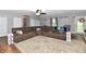 Spacious living room features a large brown sectional sofa and patterned rug at 8543 W County Road 600 S, Coatesville, IN 46121