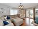 Inviting living room offers comfortable seating, stylish décor, and access to the outdoors at 8543 W County Road 600 S, Coatesville, IN 46121