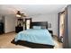 Comfortable main bedroom features a ceiling fan, carpet, and window for natural light at 8543 W County Road 600 S, Coatesville, IN 46121