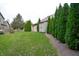Expansive backyard with healthy green space, small storage shed and mature landscaping at 8737 Chateaugay Dr, Indianapolis, IN 46217