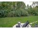 Inviting backyard featuring a cozy fire pit and chair set, perfect for outdoor relaxation and entertainment at 8737 Chateaugay Dr, Indianapolis, IN 46217