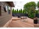 Exterior view of the house, wood deck, and landscaping perfect for outdoor entertaining at 8737 Chateaugay Dr, Indianapolis, IN 46217