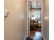 Bedroom view from hallway with hardwood floors, tray ceiling, and large window at 8737 Chateaugay Dr, Indianapolis, IN 46217