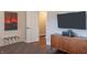 Stylish bedroom with a modern TV, wooden cabinet, and comfortable bed with unique decor at 8737 Chateaugay Dr, Indianapolis, IN 46217