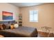 Bedroom with a comfortable bed, modern artwork, a bright window and stylish furnishings at 8737 Chateaugay Dr, Indianapolis, IN 46217