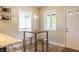 Breakfast nook includes a table, seating, and an exterior door at 8737 Chateaugay Dr, Indianapolis, IN 46217
