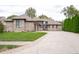 Charming single-Gathering home featuring a brick exterior, attached garage, and a well-maintained front yard at 8737 Chateaugay Dr, Indianapolis, IN 46217