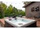Backyard hot tub and seating area with seasonal decor, perfect for entertaining or unwinding outdoors at 8737 Chateaugay Dr, Indianapolis, IN 46217