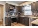 Modern kitchen featuring stainless steel appliances, granite countertops, and a stylish tile backsplash at 8737 Chateaugay Dr, Indianapolis, IN 46217