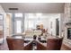 Open-concept living area showcasing hardwood floors, slider barn doors, dining room, and ample natural light at 8737 Chateaugay Dr, Indianapolis, IN 46217