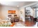 Inviting living room with hardwood floors, comfortable seating, and an open doorway, perfect for entertaining at 8737 Chateaugay Dr, Indianapolis, IN 46217