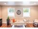 Cozy living room featuring hardwood floors, comfortable seating, and natural light, perfect for relaxation at 8737 Chateaugay Dr, Indianapolis, IN 46217