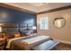 Main bedroom featuring hardwood floors, tray ceilings, and ample light at 8737 Chateaugay Dr, Indianapolis, IN 46217