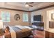 Main bedroom featuring hardwood floors, ample light, and ensuite bathroom at 8737 Chateaugay Dr, Indianapolis, IN 46217