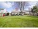 Expansive backyard featuring a lush lawn, a patio with outdoor seating and a pergola, perfect for relaxation and entertaining at 10047 Perlita Pl, Fishers, IN 46038