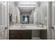 Bathroom vanity with great lighting and a view of the Primary bedroom in the mirror at 10047 Perlita Pl, Fishers, IN 46038