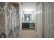 Hallway bathroom featuring a shower-tub combination, vanity, and white doors at 10047 Perlita Pl, Fishers, IN 46038