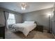 Cozy bedroom with neutral walls, soft carpet, a queen-sized bed, and natural light at 10047 Perlita Pl, Fishers, IN 46038