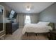 A comfortable bedroom offering a queen-sized bed, dark furniture, and window with sheer curtains at 10047 Perlita Pl, Fishers, IN 46038