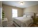 Neutral bedroom featuring a comfortable queen bed and lots of light at 10047 Perlita Pl, Fishers, IN 46038
