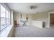 Bright bonus room boasts neutral walls, a ceiling fan and a large window for ample natural light at 10047 Perlita Pl, Fishers, IN 46038