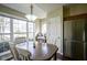 Dining room featuring a large window and plenty of natural light with hardwood floors at 10047 Perlita Pl, Fishers, IN 46038