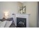 Close-up of the fireplace showcasing a clean white mantel and decorative accents at 10047 Perlita Pl, Fishers, IN 46038