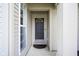 Front door view with a decorative window and classic design at 10047 Perlita Pl, Fishers, IN 46038