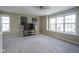 Spacious living area with lots of natural light, large windows, and ceiling fan at 10047 Perlita Pl, Fishers, IN 46038