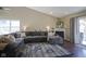 Bright living room with vaulted ceilings, fireplace, and sliding glass doors to the backyard at 10047 Perlita Pl, Fishers, IN 46038
