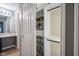Organized walk-in closet with custom shelves, drawers, and compartments for optimal storage solutions at 10047 Perlita Pl, Fishers, IN 46038