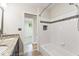 Bathroom featuring a granite vanity, tiled shower and updated finishes at 10129 Guilford Ave, Carmel, IN 46280
