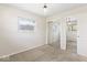 Neutral bedroom featuring a window, carpet, and closets with mirrored sliding doors at 10129 Guilford Ave, Carmel, IN 46280