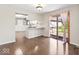 Open concept with dining area, kitchen island, and sliding doors to the backyard at 10129 Guilford Ave, Carmel, IN 46280