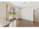 Dining area shows wood floors, sliding glass doors to backyard and access to other rooms at 10129 Guilford Ave, Carmel, IN 46280