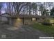 Charming home with attached garage, well-maintained lawn, and mature trees at 10129 Guilford Ave, Carmel, IN 46280