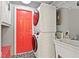 Functional laundry room featuring a stacked washer/dryer and bright accents at 10129 Guilford Ave, Carmel, IN 46280